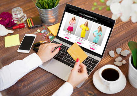 Woman using credit card while shopping onlineの写真素材