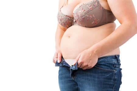Obesity concept, woman can't close her jeans anymoreの写真素材