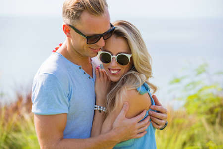 Portrait of romantic couple in sunglassesの写真素材