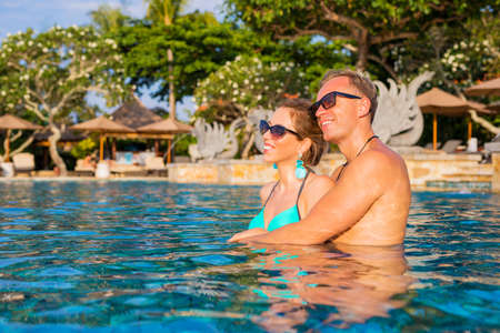 Happy couple in swimming poolの写真素材