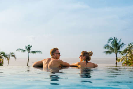 Happy couple in infinity poolの写真素材