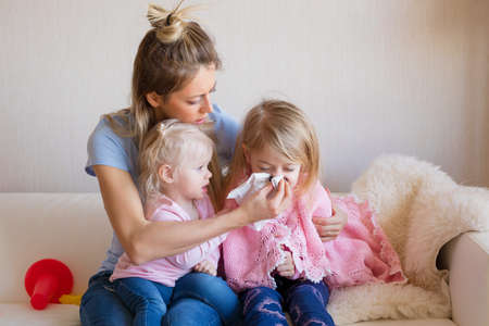Mother taking care of her sick childの写真素材