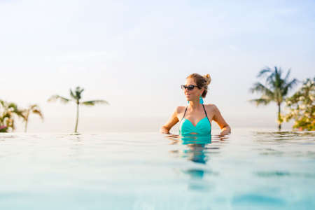 Woman in luxury tropical resortの写真素材