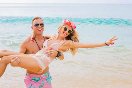 Couple having fun on the beachの写真素材