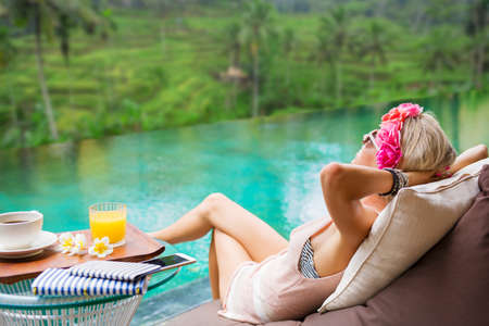 Woman relaxing in tropical villaの写真素材