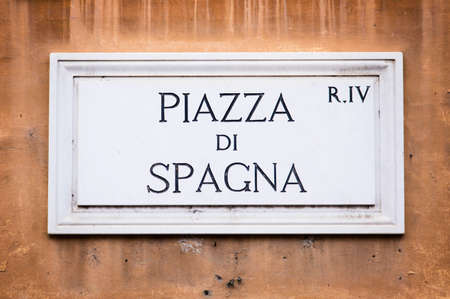 Piazza di Spagna street sign on wall in Rome, Italyの写真素材
