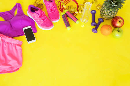 Fitness equipment on yellow backgroundの写真素材