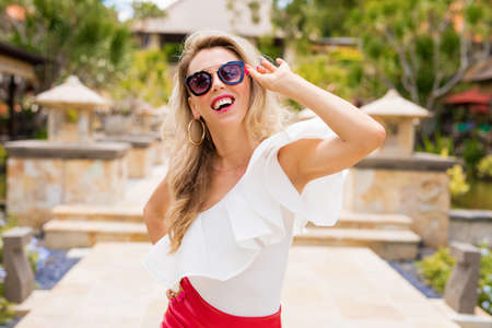 Happy woman in toprical destinationの写真素材