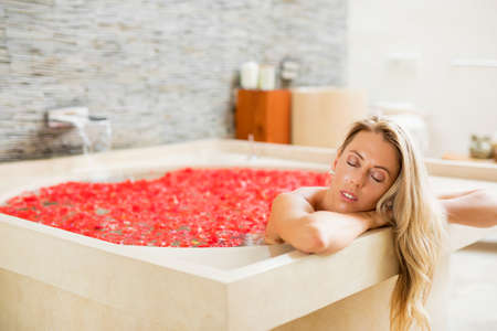 Woman sleeping in bathの写真素材