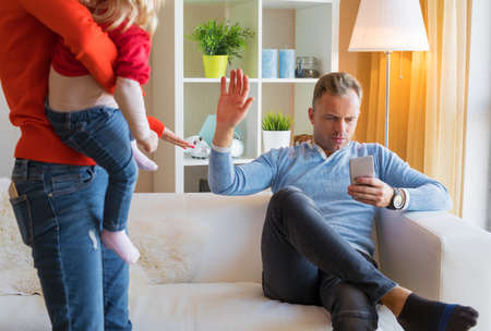 Young couple having difficulties at parenting togetherの写真素材