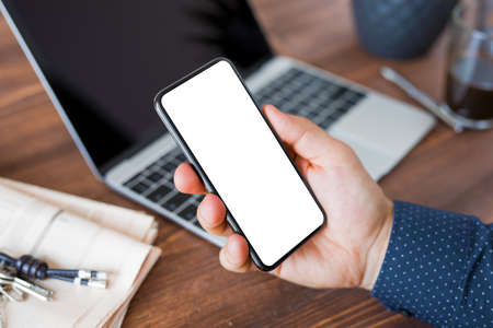 Business man using smartphone. Mobile phone screen mockup.の写真素材