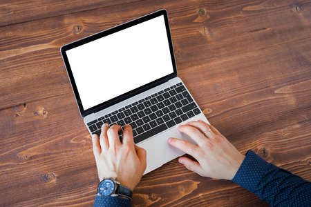 Business man working on laptop computer. Laptop screen mockup.の写真素材