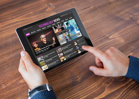 Sample tech news website on tabletの写真素材