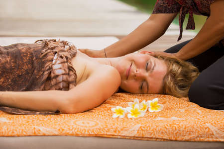 Woman enjoying full body massageの写真素材