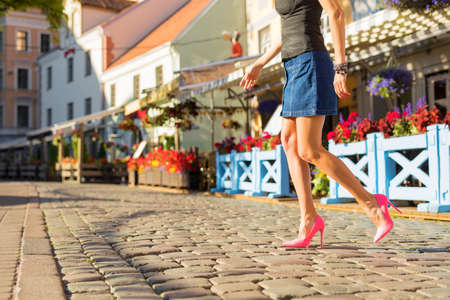 Woman walking in old townの写真素材