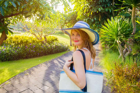 Joyful woman in tropical parkの写真素材