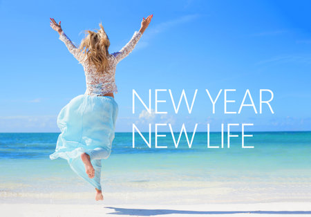 New year new life quote on the image of woman jumping in the air on the beach.