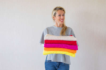Happy woman with fresh laundryの写真素材