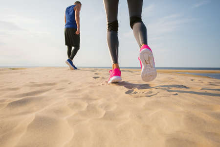 Woman and man getting ready for training outdoorsの写真素材