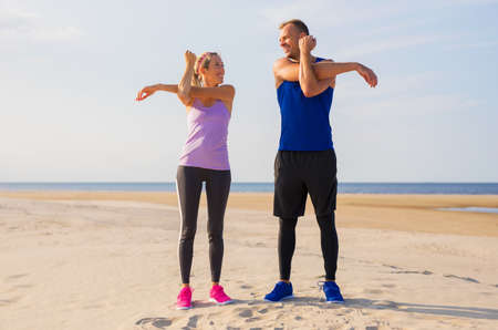 Couple stretching before workout togetherの写真素材