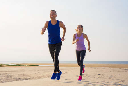 Man and woman exercise outdoorsの写真素材