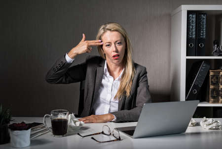 Tired woman hates her jobの写真素材