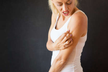 Woman having itchy skin problemの写真素材