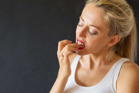 Woman biting her nailsの写真素材