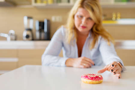 Woman having sugar cravingsの写真素材