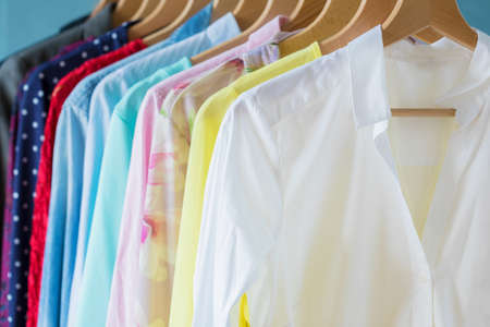 Female clothes hanging on rackの写真素材