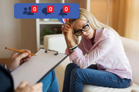 Woman visiting psychologist and feeling depressed about her unpopularity on social mediaの写真素材