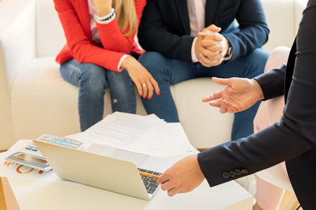 Financial adviser consulting young couple