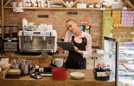 Woman working in cafeの写真素材