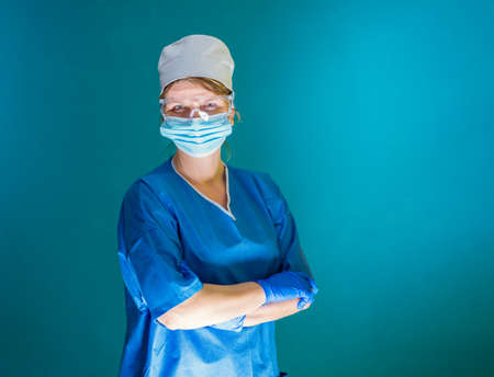 Portrait of female doctor with medical glasses and face maskの写真素材