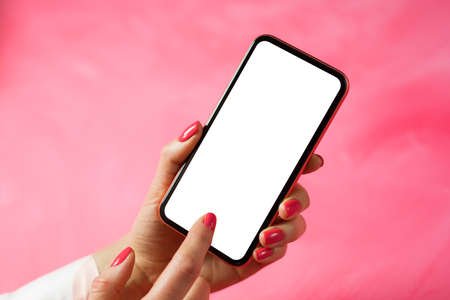 Woman using mobile phone and touching screen with finger, mockup for app design.の写真素材