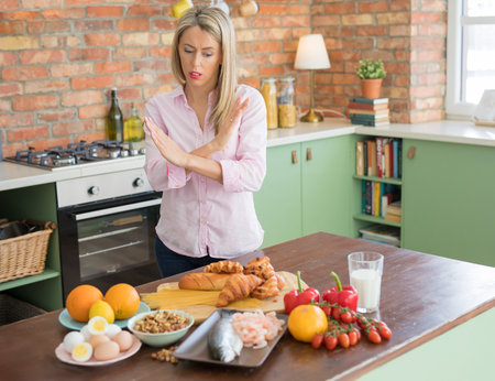 Woman having problem with all different kinds of food allergiesの写真素材