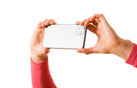 Person taking picture with mobile phone, photo isolated on white backgroundの写真素材