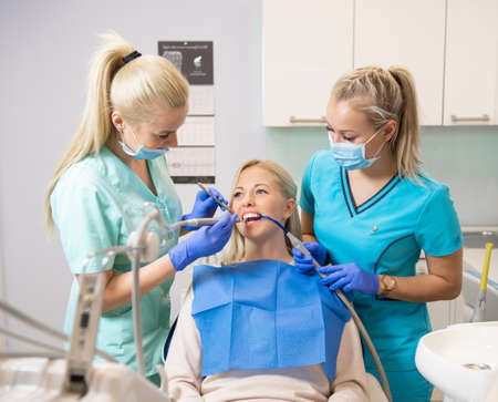 Female patient having dental examination in dentist officeの写真素材