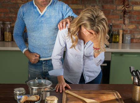 Woman crying because of aggressive and violent manの写真素材