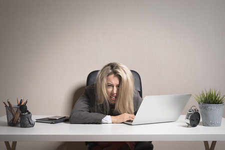 Woman feeling exhausted at work
