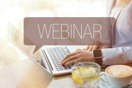Concept of webinar, person taking distance learning courses online by using laptop computer.