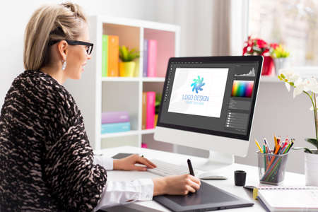 Graphic design artist working on client's logo designの写真素材