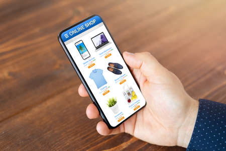 Man browsing online store with wide variety of products availableの写真素材