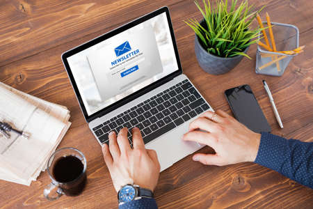 Man subscribing to weekly newsletter onlineの写真素材