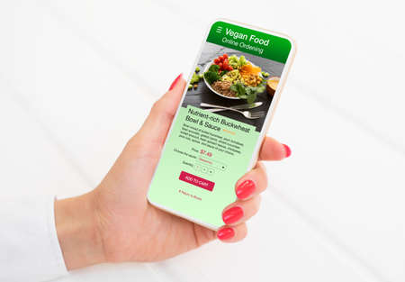 Woman ordering vegan food onlineの写真素材