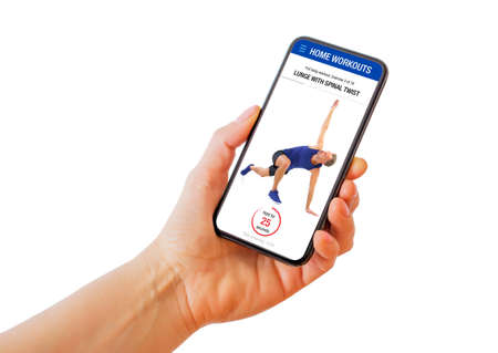 Person holding phone with home workouts fitness app where instructor demonstrates workout exercisesの写真素材