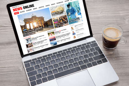 Sample news website opened on laptop's screen. All contents on website are completely made up.の写真素材