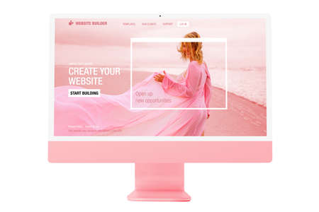 Sample website on modern pink colored desktop computerの写真素材