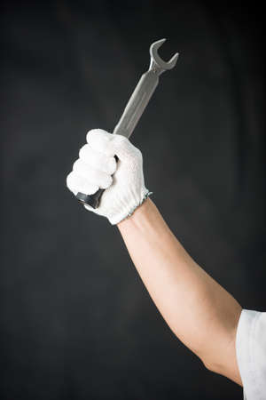 Wrench in handの写真素材