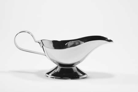 Old-fashioned antique precious silver sauce boat or milk jugの写真素材